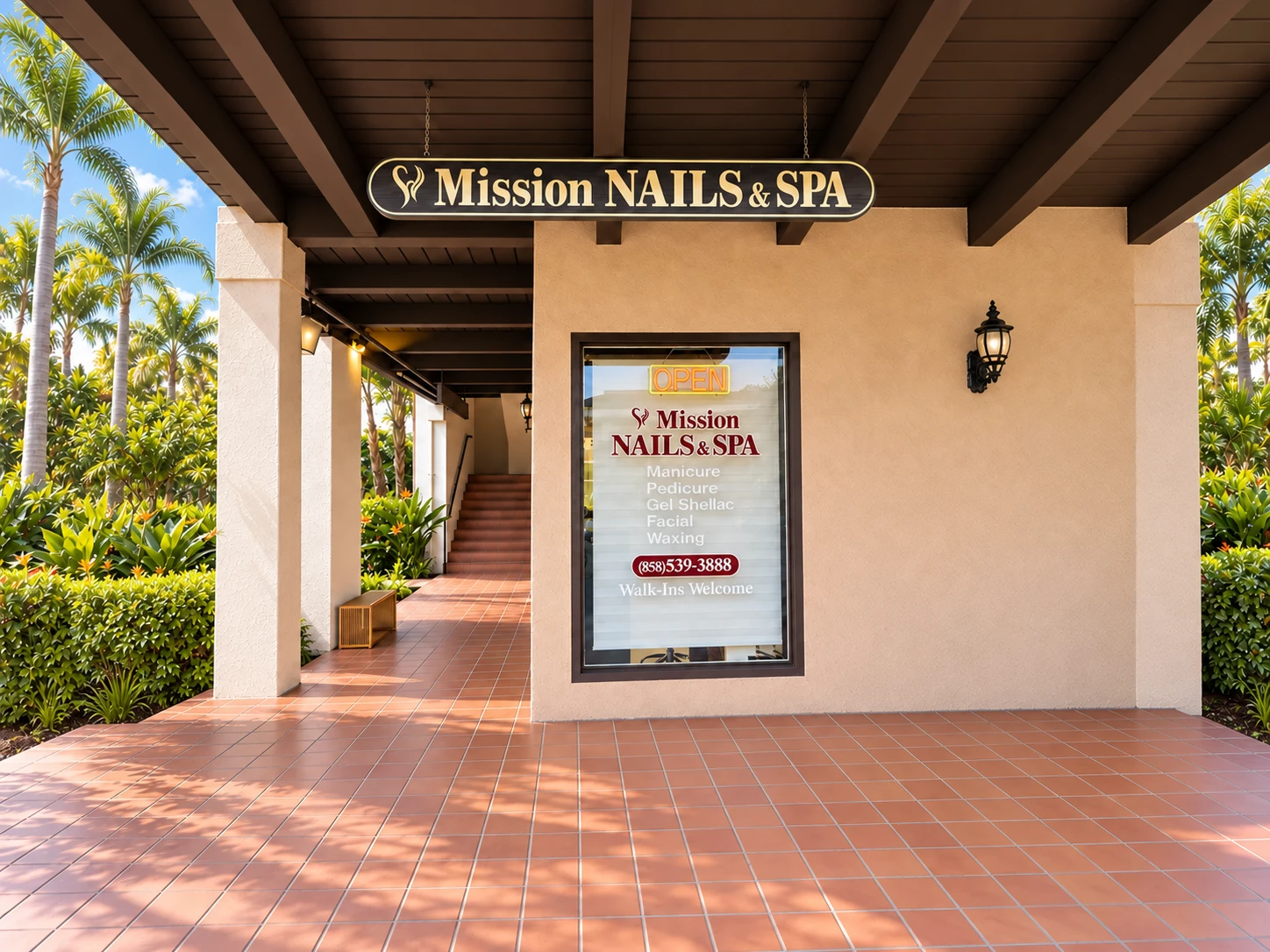 The full Mission Nails and Spa storefront sign, window and open tiled walkway